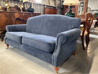 Blue fabric two seater couch